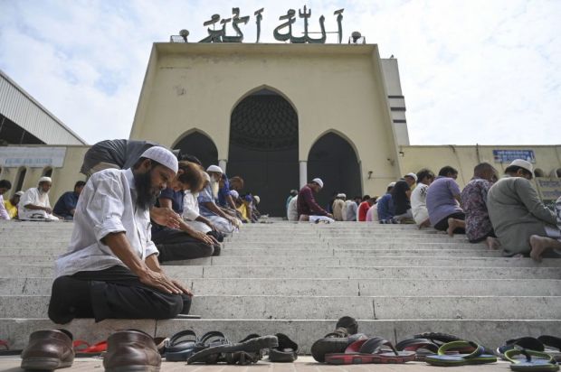 Bangladeshi Muslims offer Friday prayers after protesting against attacks on two mosques in New Zealand, in Dhaka on March 15, 2019. - Attacks on two Christchurch mosques left at least 49 dead on March 15, with one gunman -- identified as an Australian extremist -- apparently livestreaming the assault that triggered the lockdown of the New Zealand city. (Photo by MUNIR UZ ZAMAN / AFP)        (Photo credit should read MUNIR UZ ZAMAN/AFP/Getty Images)
