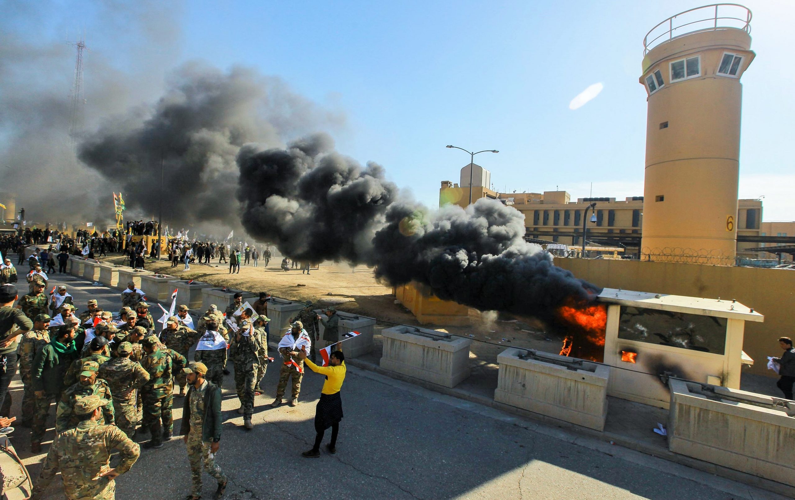 31 December 2019, Iraq, Baghdad: Iraqi Shiite militia supporters burn property during a demonstration inside the US embassy compound in Baghdad. Iraqi mourners on Tuesday stormed the building of the US embassy in Baghdad's heavily fortified Green Zone after deadly US airstrikes on sites of a Shiite militia. Photo: Ameer Al Mohmmedaw/dpa (Photo by Ameer Al Mohmmedaw/picture alliance via Getty Images)