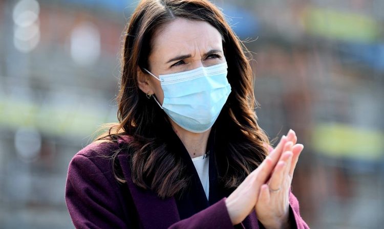 AUCKLAND, NEW ZEALAND - AUGUST 31: New Zealand Prime Minister Jacinda Ardern wears a mask when answering questions from the media after visiting the Kainga Ora housing development on August 31, 2020 in Auckland, New Zealand. Face coverings are now compulsory for all New Zealanders over the age of 12 on public transport or planes under current Alert Level restrictions in place across the country. Auckland is currently at Alert Level 2.5 while the rest of New Zealand is at Alert Level 2. (Photo by Hannah Peters/Getty Images)