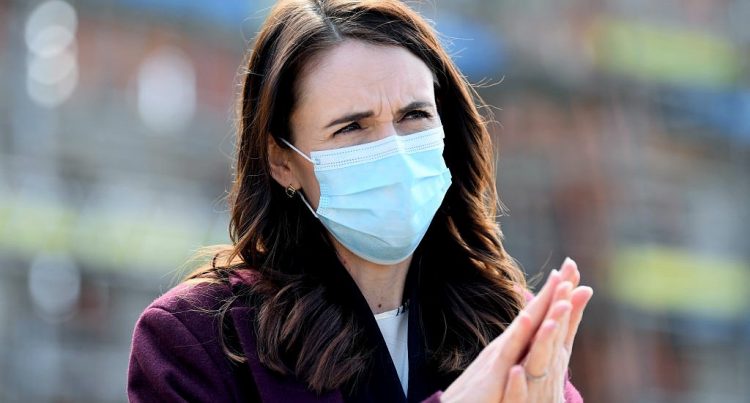 AUCKLAND, NEW ZEALAND - AUGUST 31: New Zealand Prime Minister Jacinda Ardern wears a mask when answering questions from the media after visiting the Kainga Ora housing development on August 31, 2020 in Auckland, New Zealand. Face coverings are now compulsory for all New Zealanders over the age of 12 on public transport or planes under current Alert Level restrictions in place across the country. Auckland is currently at Alert Level 2.5 while the rest of New Zealand is at Alert Level 2. (Photo by Hannah Peters/Getty Images)