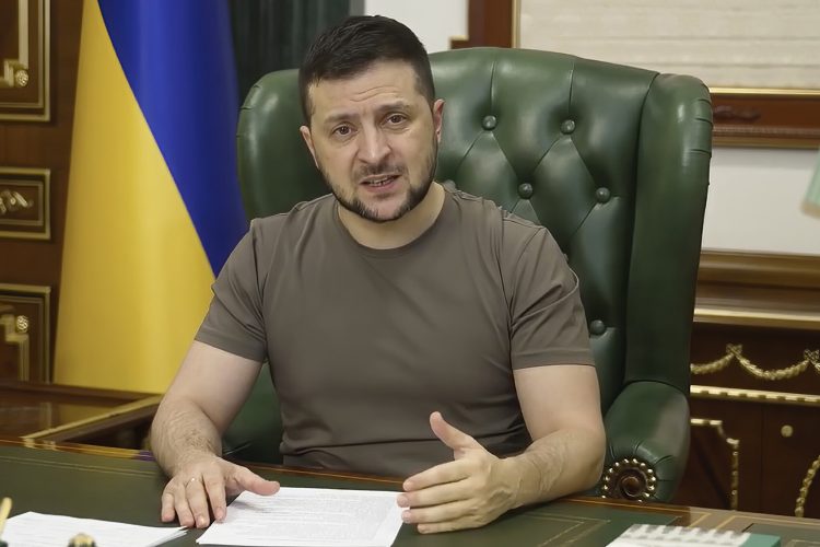 In this image from video provided by the Ukrainian Presidential Press Office, Ukrainian President Volodymyr Zelenskyy speaks from Kyiv, Ukraine, early Monday, March 21, 2022. (Ukrainian Presidential Press Office via AP)