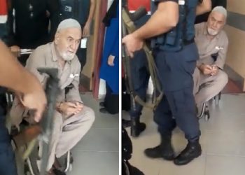 Tekerlekli sandalyedeki yaşlı mahpus elleri kelepçeli muayene edildi